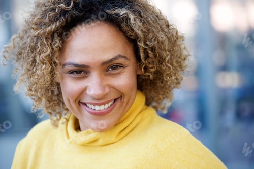 Preview: Close up happy african american woman with curly hair