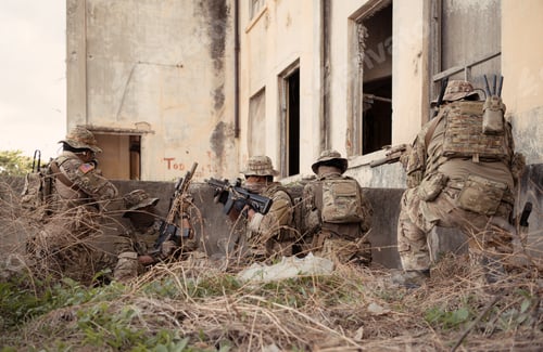 Preview: Professional marine soldiers training with weapon on a military range.