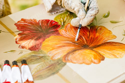 Preview: gloved hand drawing with brushes