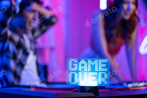 Preview: Close up of e-sport couple loser gamer play online video game on computer.