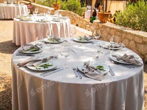 Preview: Beautiful outdoor wedding decoration in city. Candles and dried flowers and accessories with