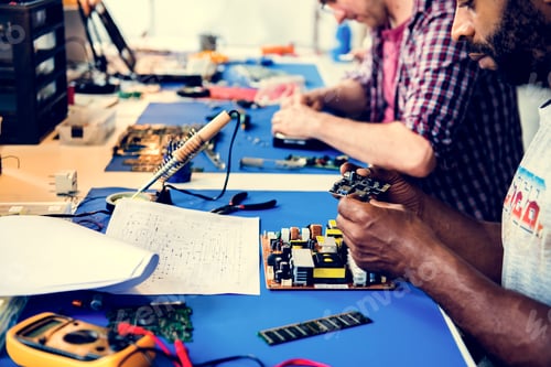 Preview: Side view of technician working on computer mainboard