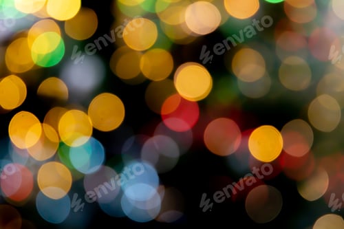 Preview: Dark background with a vibrant display of multicolored bokeh lights.