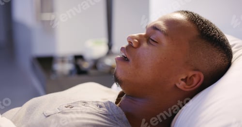 Preview: Black man, sleeping and tired in home on bed for relax, comfortable and rest with peace on weekend.
