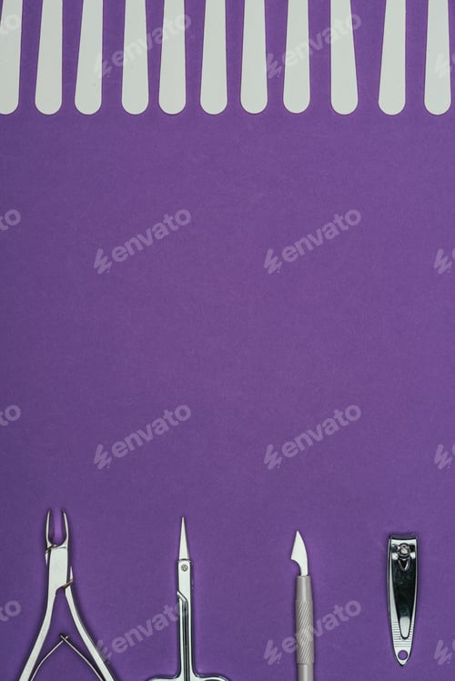 Preview: top view of manicure tools isolated on purple