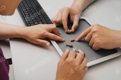 Preview: Very small hearing aid in hands