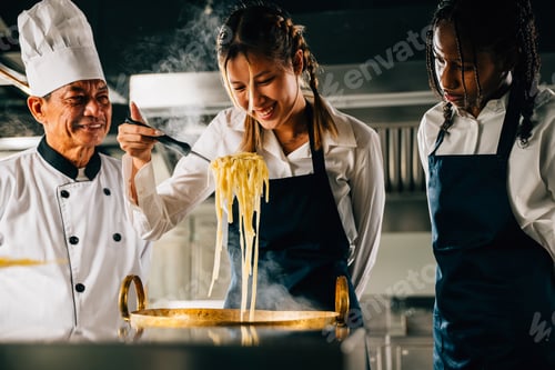 Preview: Chef instructs kids cooking noodle in kitchen. Schoolgirls in uniform create ramen soup. Teacher