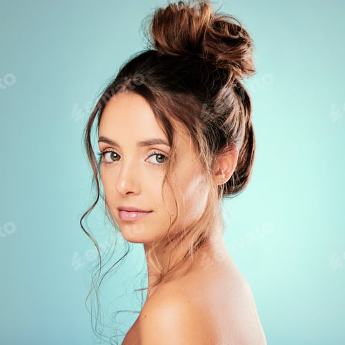 Preview: Studio portrait of an attractive young woman posing against a blue background