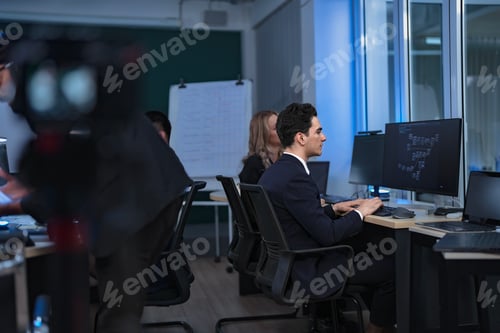 Preview: IT specialist guides a software developer through the company's
