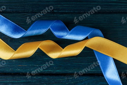 Preview: Ribbons in Ukrainian flag colors on wooden background