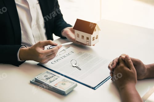 Preview: Business people home sales broker is using a pen pointing to the house