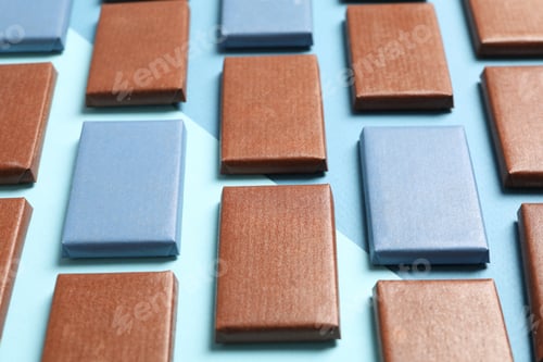 Preview: Blue and brown chocolate bars on a blue background