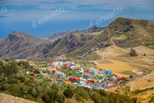 Preview: A townscape in Tenerife, highlighted by lush hills, fields, buildings
