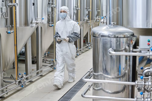 Preview: Worker working at chemical factory