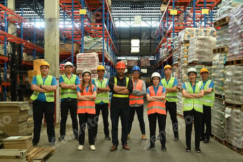 Preview: Group of warehouse worker standing in line with arms crossed together at logistic warehouse.
