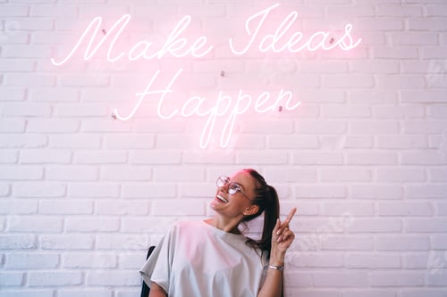 Preview: Cheerful teenager near font neon message