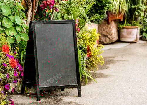 Preview: View of black advertisement blackboard on the street