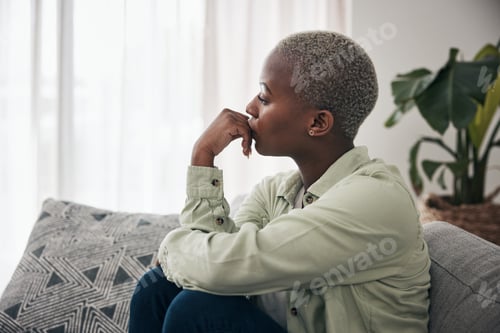 Preview: Woman, thinking and depression on sofa for sad memory, mental health risk and anxiety of debt. Stre