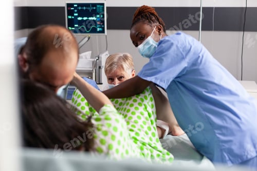 Preview: Close up of multi ethnic medical team delivering child