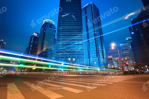 Preview: urban roads car light trails of modern buildings