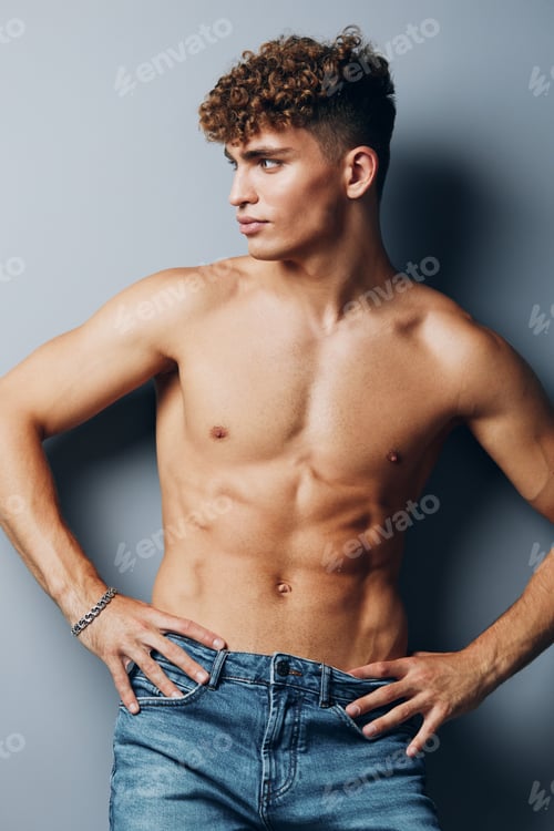 Preview: man gray fitness athletic young curly strong gray background sexy bicep