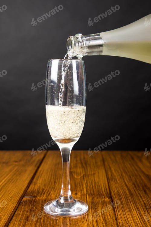 Preview: Champagne glass on a wooden background