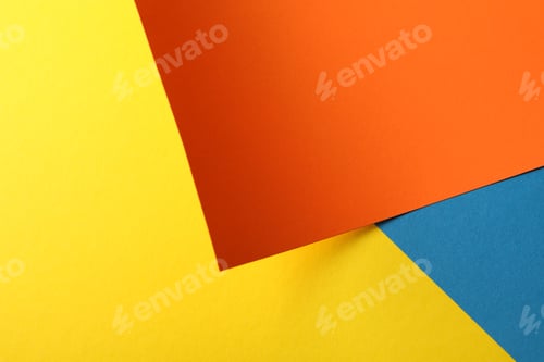 Preview: Background made of color sheets: yellow, orange and blue, close up