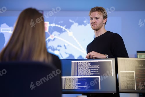 Preview: Team analyzing cyber threats using monitors in a security operations center