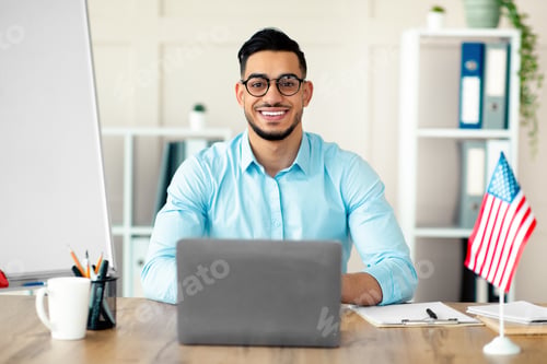 Preview: Guy foreign languages tutor teaching English online using laptop at home office