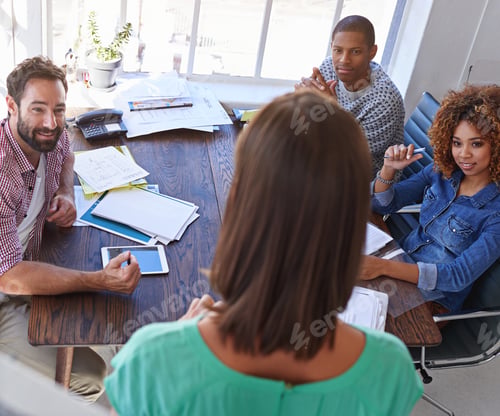 Preview: Shot of a young businesswoman giving a presentation to her design team