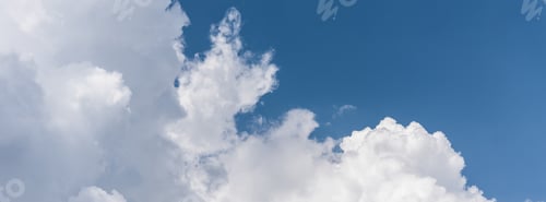 Preview: Blue sky background with a fluffy clouds