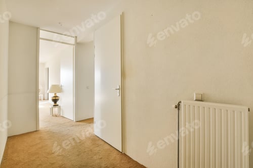 Preview: a living room with a radiator and a white door