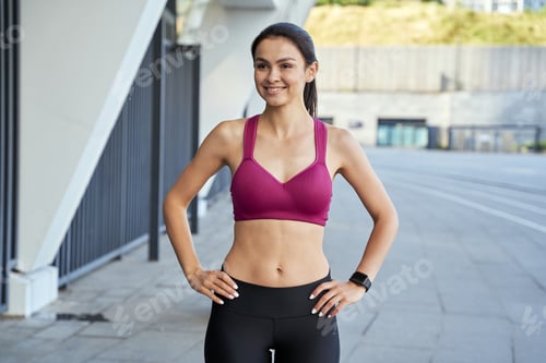 Preview: Athletic Woman Posing in Urban Outdoor Setting