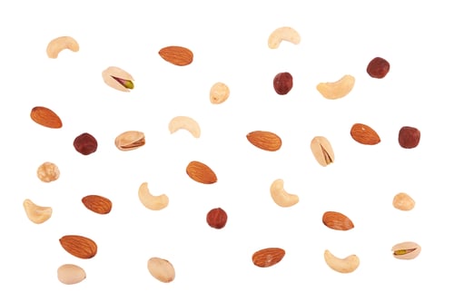 Preview: Heap of mixed nuts isolated on white background