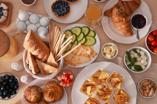 Preview: Dishes with different food on table, flat lay. Luxury brunch