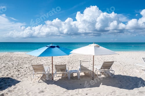 Preview: High-angle of a Grace Bay sandy beach, gazebos, cloudy sky background