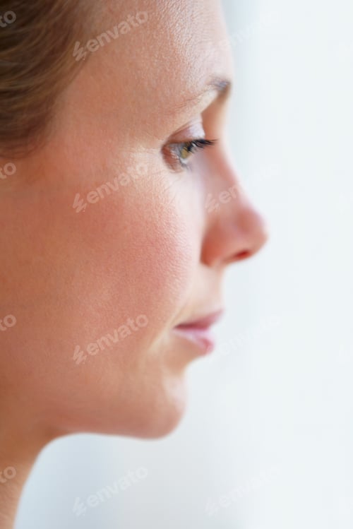 Preview: Uncertain of her future. Pensive mature woman looking away - profile view.