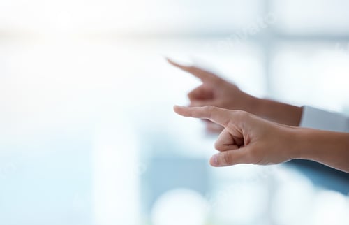 Preview: Shot of a group of unrecognisable businesspeople pointing during a meeting in a modern office