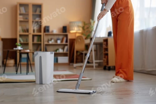 Preview: Woman Mopping Floors During Spring Cleaning