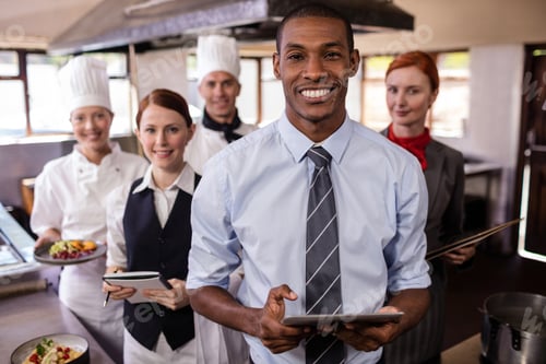 Preview: Group of hotel staffs working in kitchen