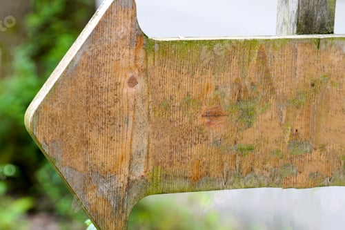 Preview: Closeup shot of a wooden arrow sign showing a direction