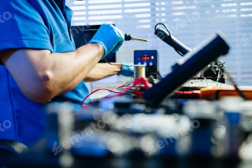 Preview: The technician repairing the motherboard in the lab with copy space.