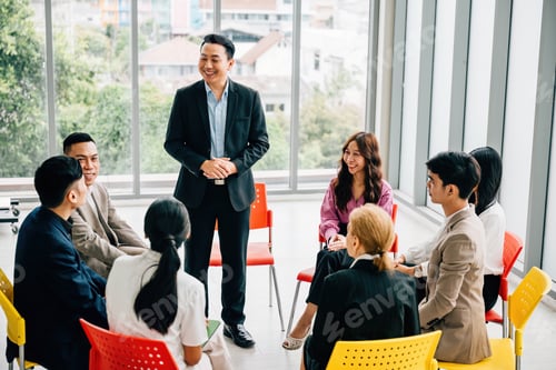 Preview: A diverse team of business professionals collaborates in a modern office. They engage in planning