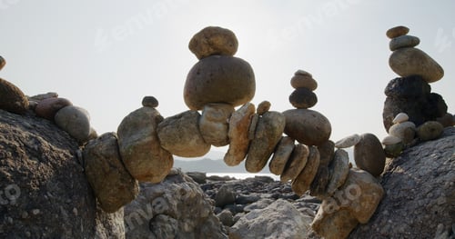Preview: Arch of pebbles in balancing on the sea coast