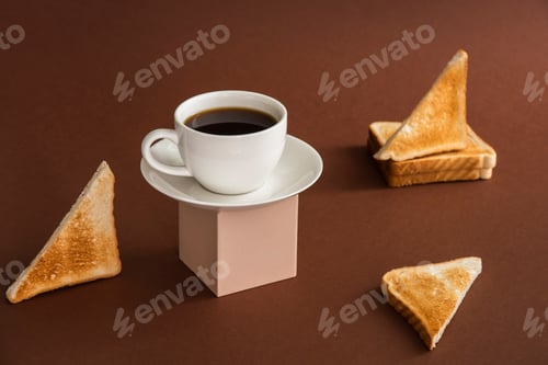 Preview: Cup of coffee on cube pedestal with toasts on brown