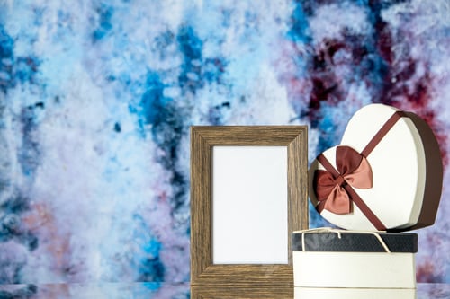 Preview: front view valentines day presents with empty picture frame on light background feeling love couple