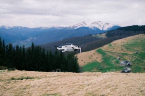 Preview: Drone flight over meadow high in Manchul, Carpathian mountains. Livestock buildings. Flight, nature,