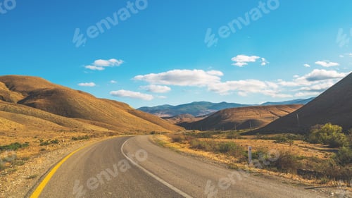 Preview: Asphalt road in mountainous terrain