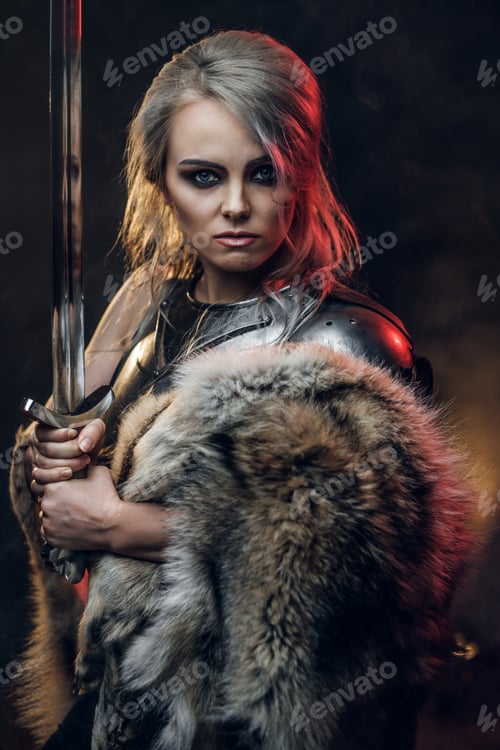 Preview: Portrait of a beautiful warrior woman holding a sword wearing steel cuirass and fur