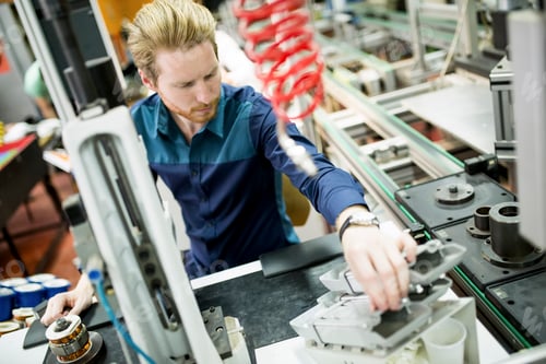 Preview: Young man in electronics workshop